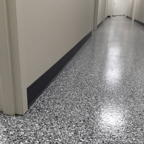 hallway with gray and black flaked epoxy floor coating