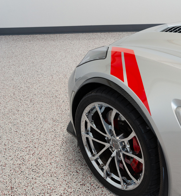 gray car in garage with beige flaked epoxy floor coating